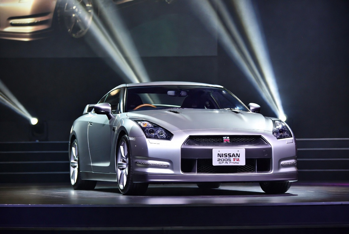 R35 GT-R during golden hour on open road showing Proto bloodline design language