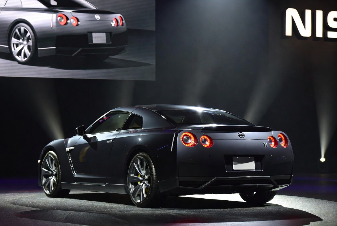 GT-R Proto striking rear three-quarter view highlighting quad taillight design inherited by the R35