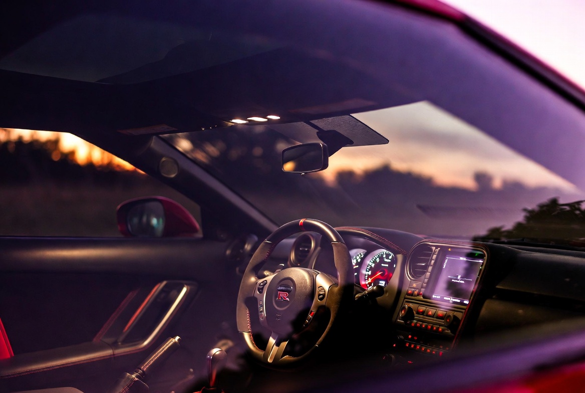 GT-R Proto and production R35 front fascia comparison showing refined design evolution from show car to road car