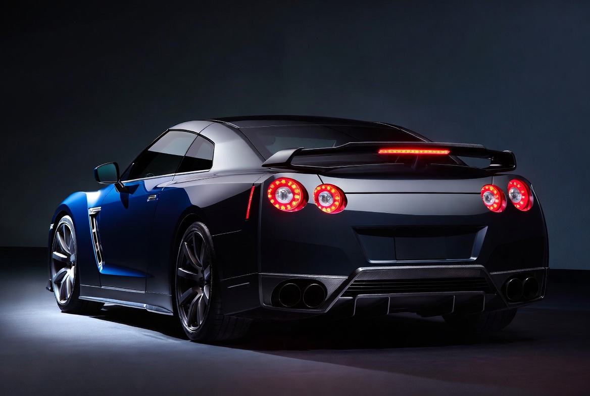 R35 GT-R navigating urban commute road with rain-wet surface in 2026